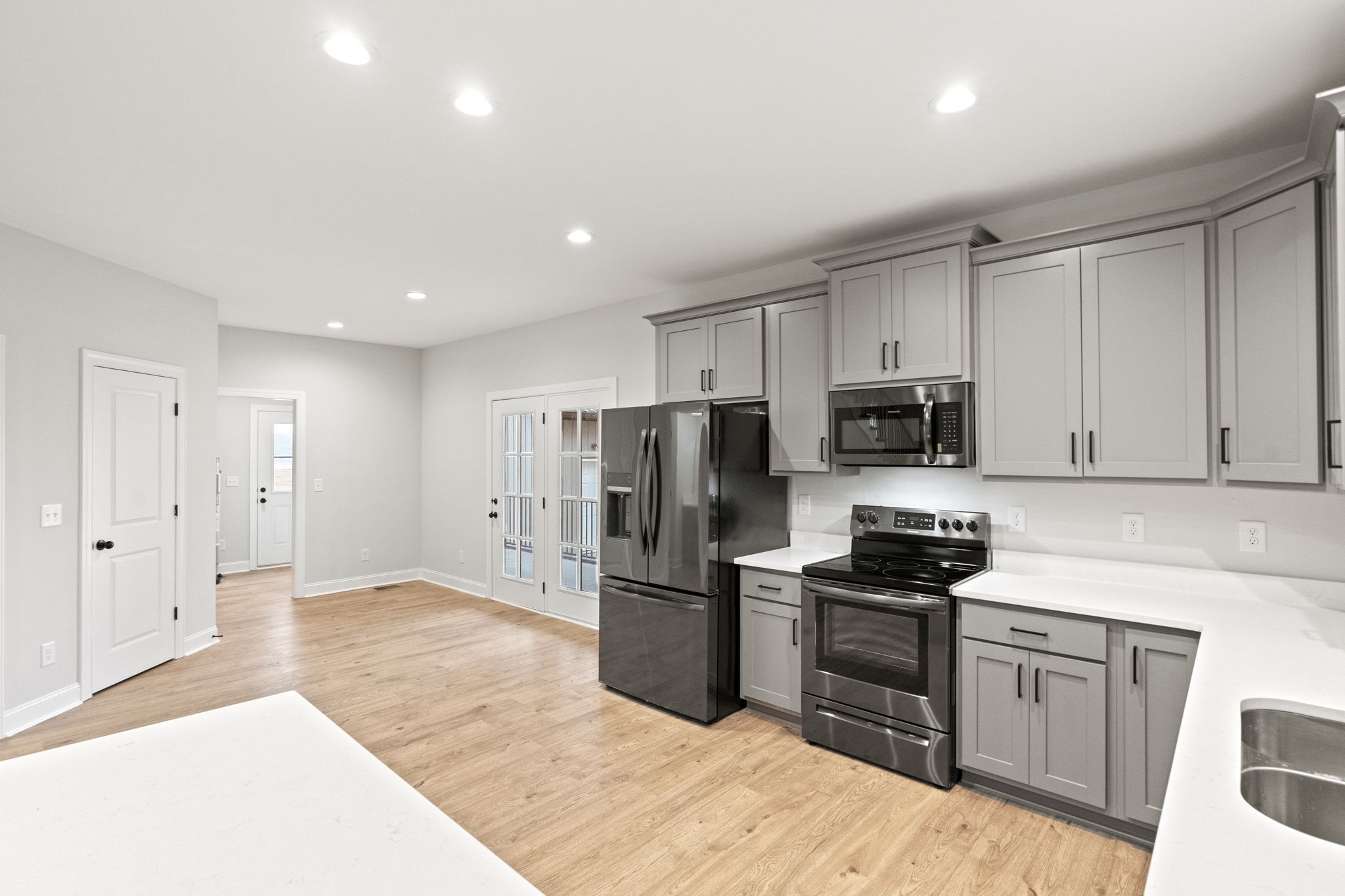 8919 Cedar Grove Road Cross Plains, TN 37049 - Photo 12 of 36 a kitchen with stainless steel appliances a refrigerator stove microwave and sink