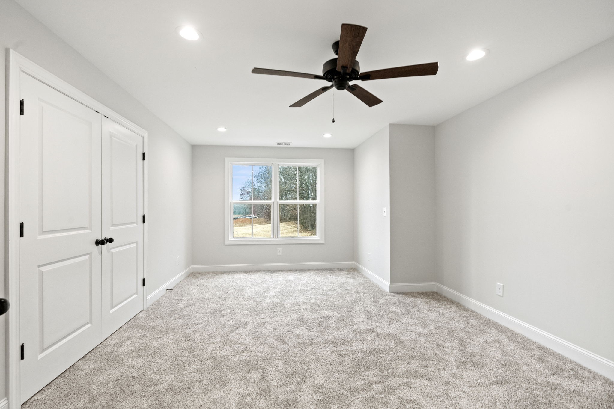8919 Cedar Grove Road Cross Plains, TN 37049 - Photo 23 of 36 a view of a livingroom with a ceiling fan & windows in a room