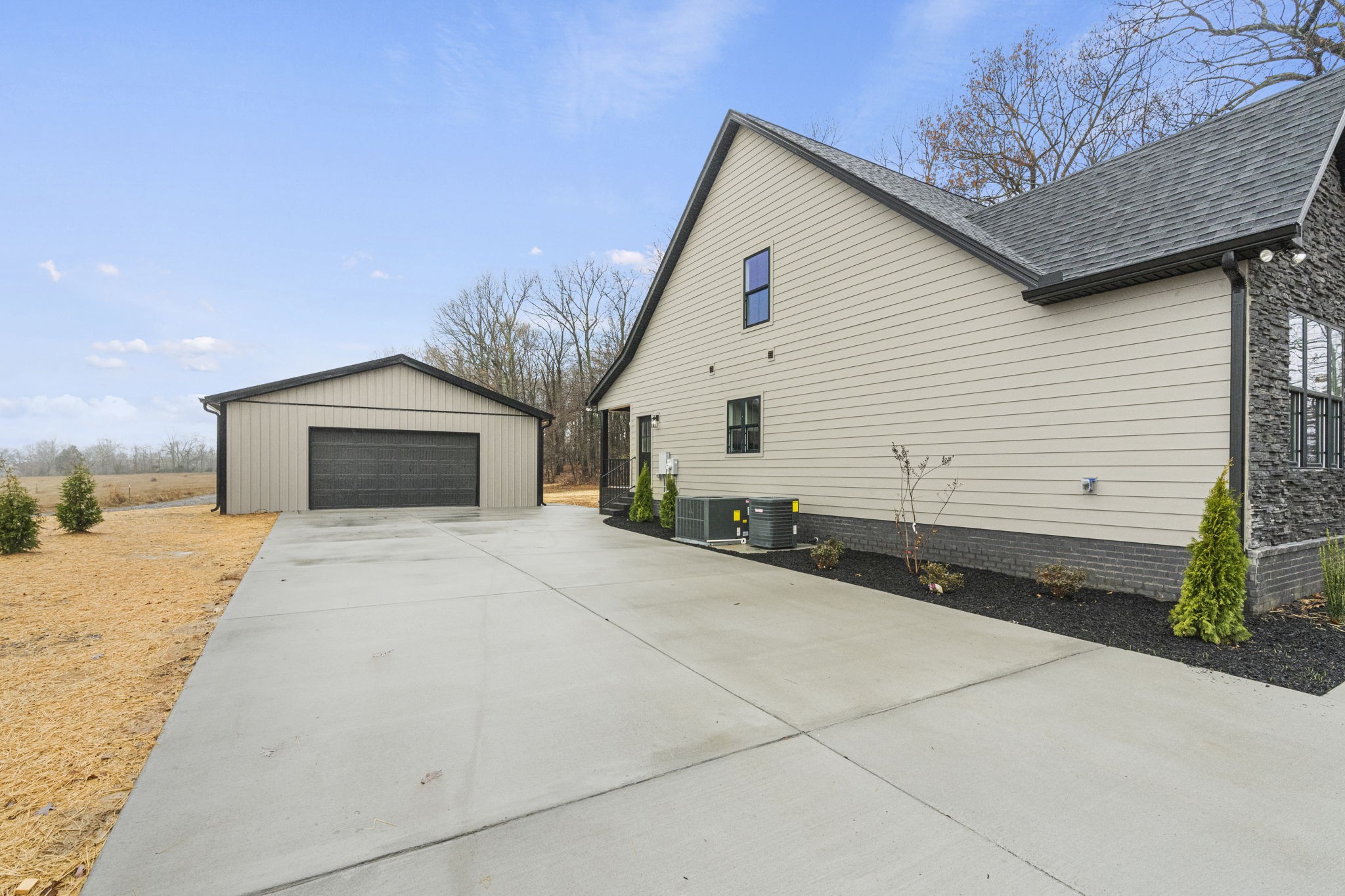 8919 Cedar Grove Road Cross Plains, TN 37049 - Photo 33 of 36 a front view of a house with a yard and garage