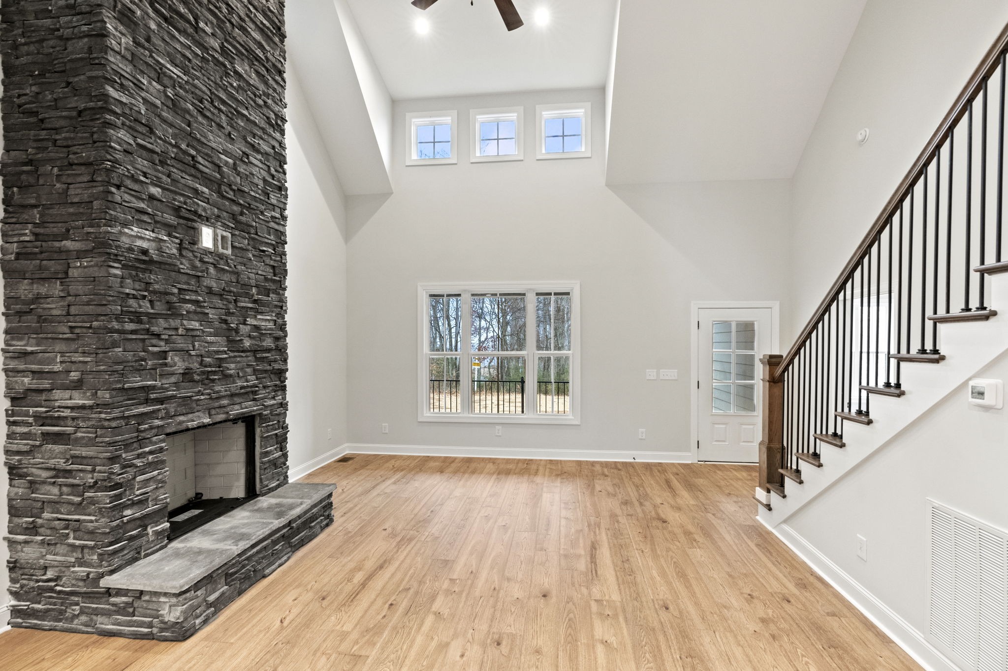 8919 Cedar Grove Road Cross Plains, TN 37049 - Photo 9 of 36 a view of an empty room with wooden floor and a fireplace