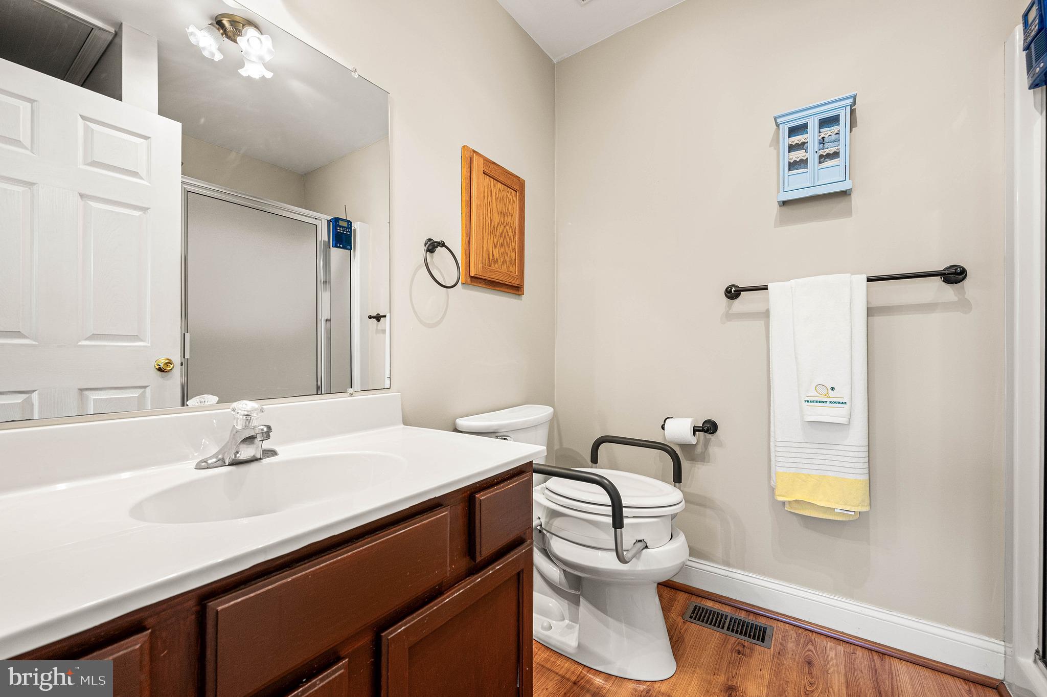 453 Claremont Road Springfield, PA 19064 - Photo 17 of 32 a bathroom with a sink a toilet and a mirror