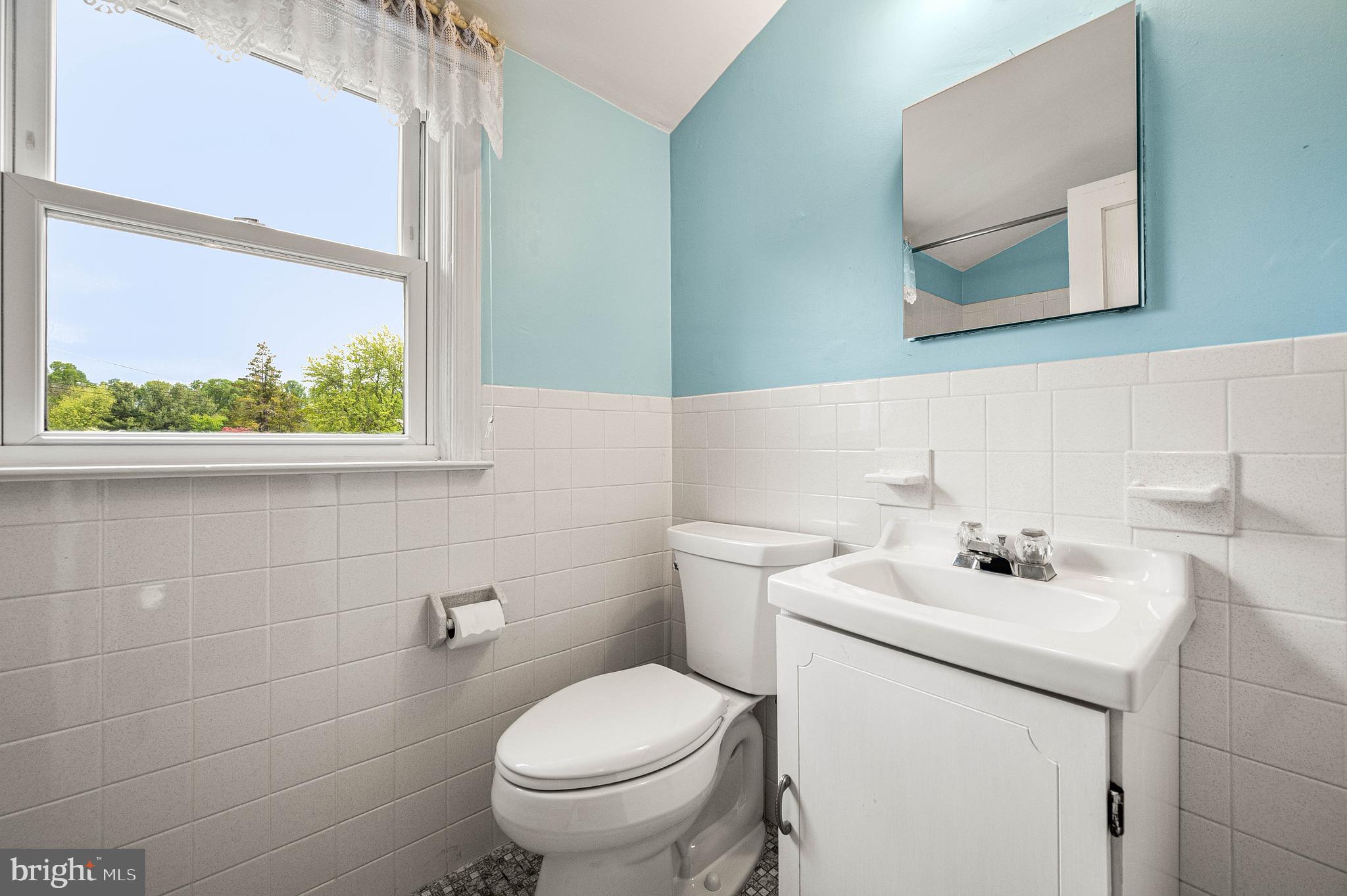 453 Claremont Road Springfield, PA 19064 - Photo 20 of 32 a bathroom with a sink a toilet and a mirror