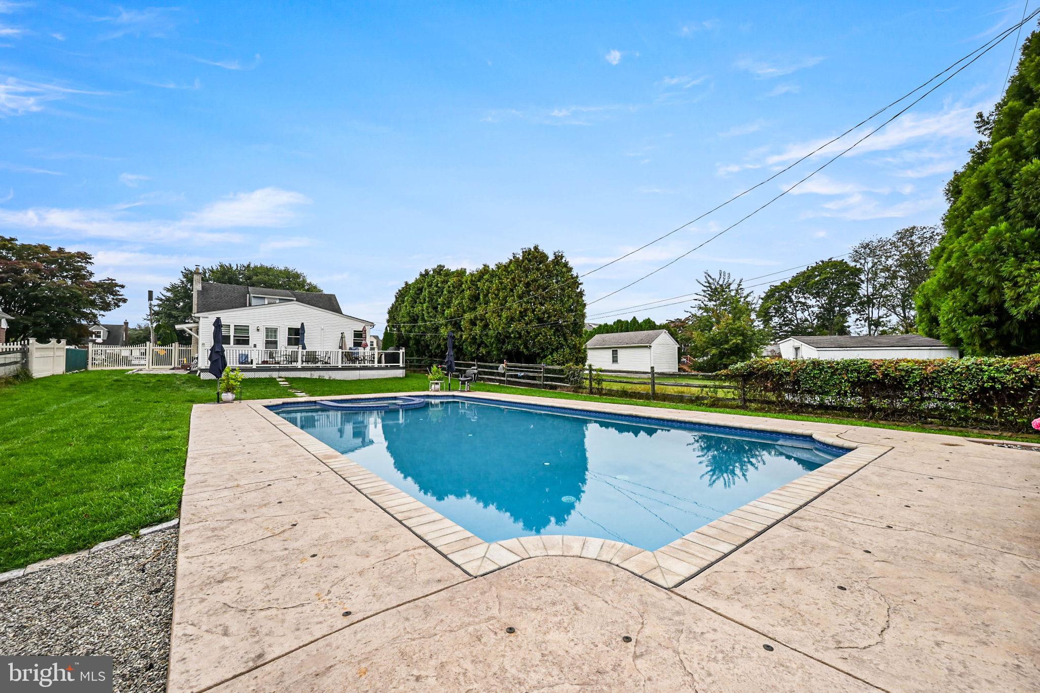453 Claremont Road Springfield, PA 19064 - Photo 30 of 32 a view of swimming pool with a yard