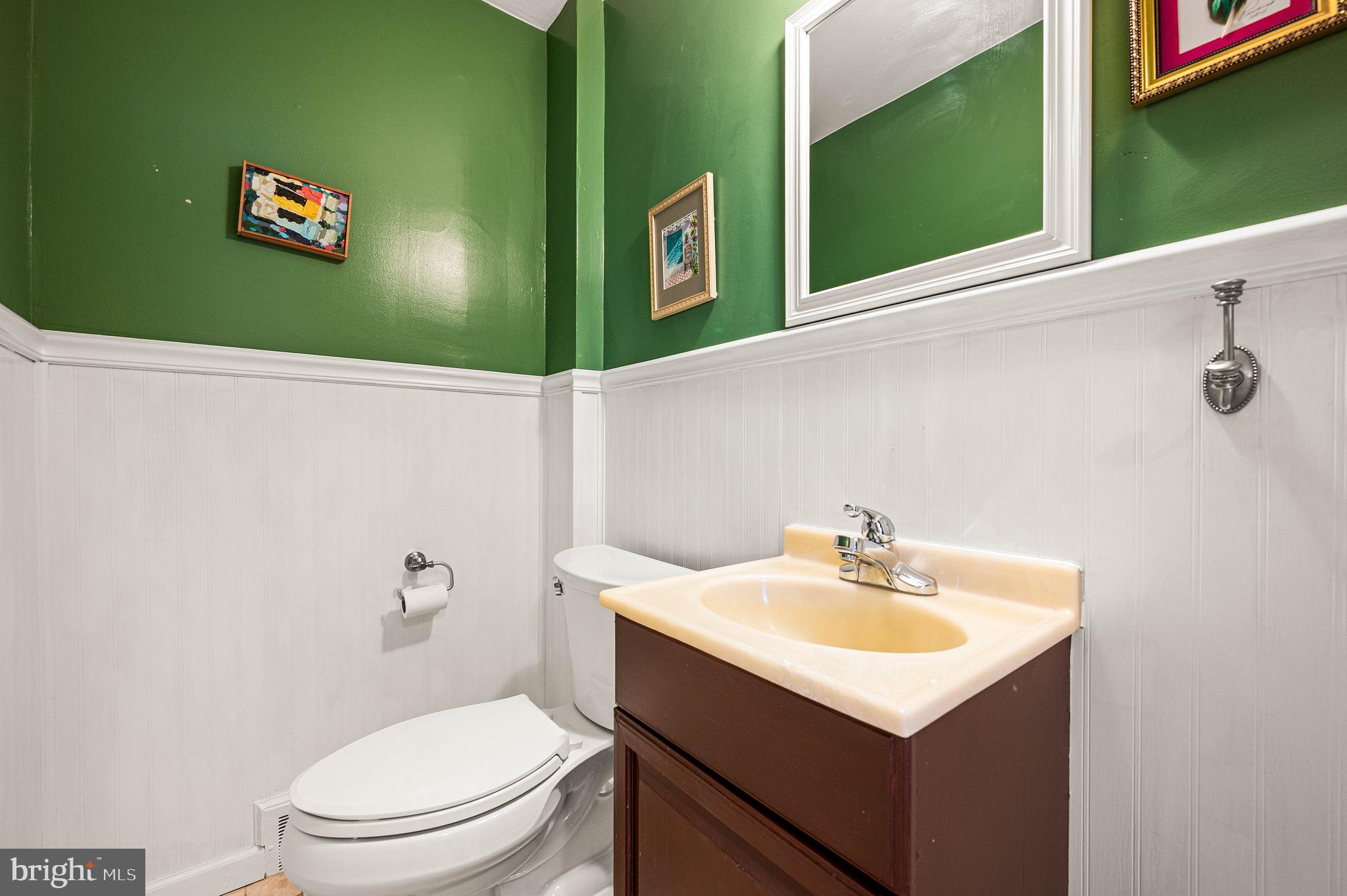 453 Claremont Road Springfield, PA 19064 - Photo 7 of 32 a bathroom with a sink a mirror and a toilet
