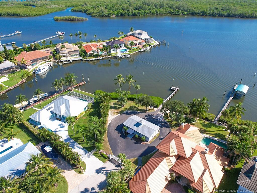 5714 Southeast Horseshoe Point Road Stuart, FL 34997 - Photo 12 of 83 an aerial view of a house with a lake view