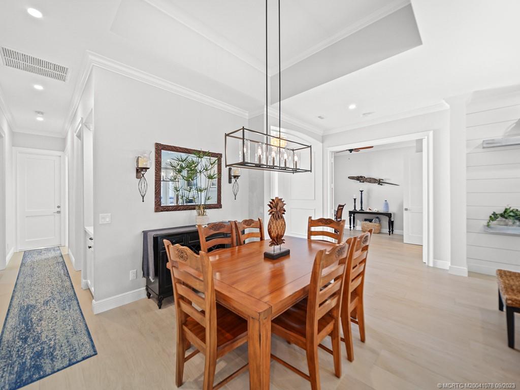 5714 Southeast Horseshoe Point Road Stuart, FL 34997 - Photo 19 of 83 a view of a dining room with furniture