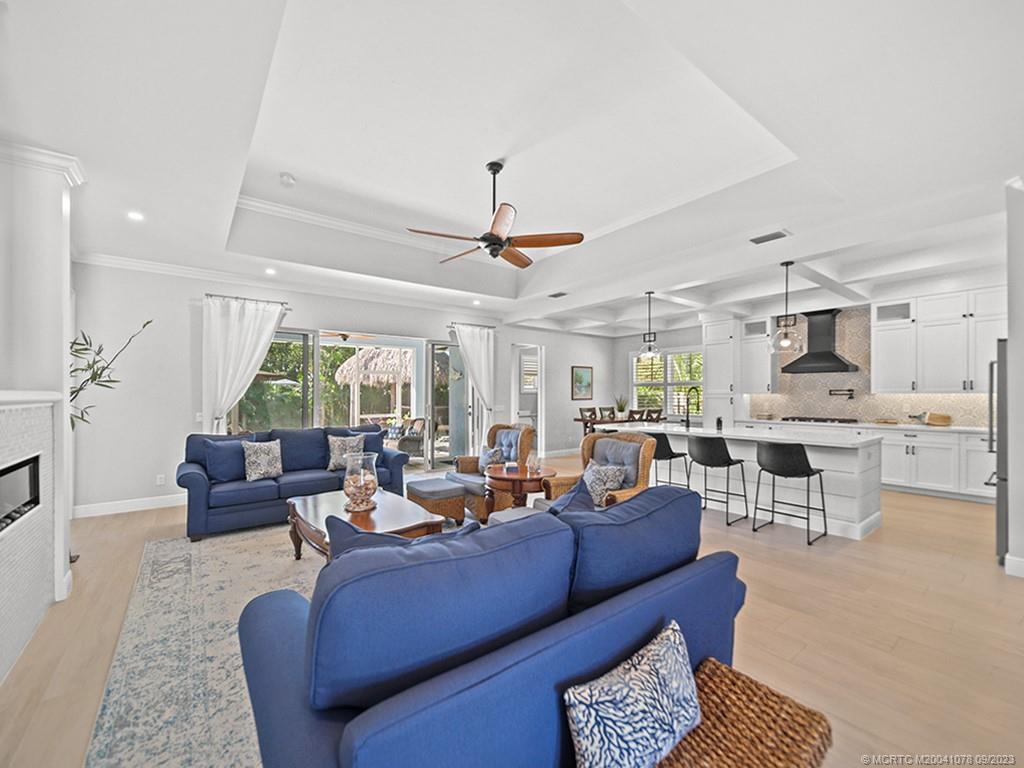 5714 Southeast Horseshoe Point Road Stuart, FL 34997 - Photo 20 of 83 a living room with furniture and a large window