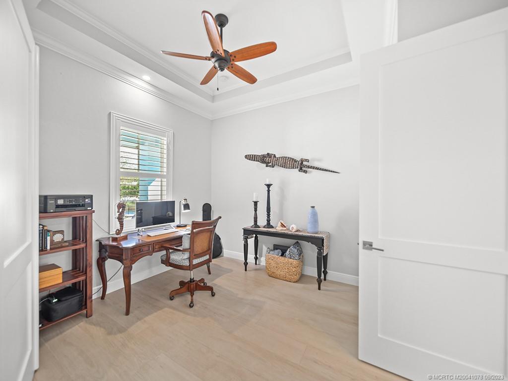 5714 Southeast Horseshoe Point Road Stuart, FL 34997 - Photo 27 of 83 a view of a workspace with furniture and a window