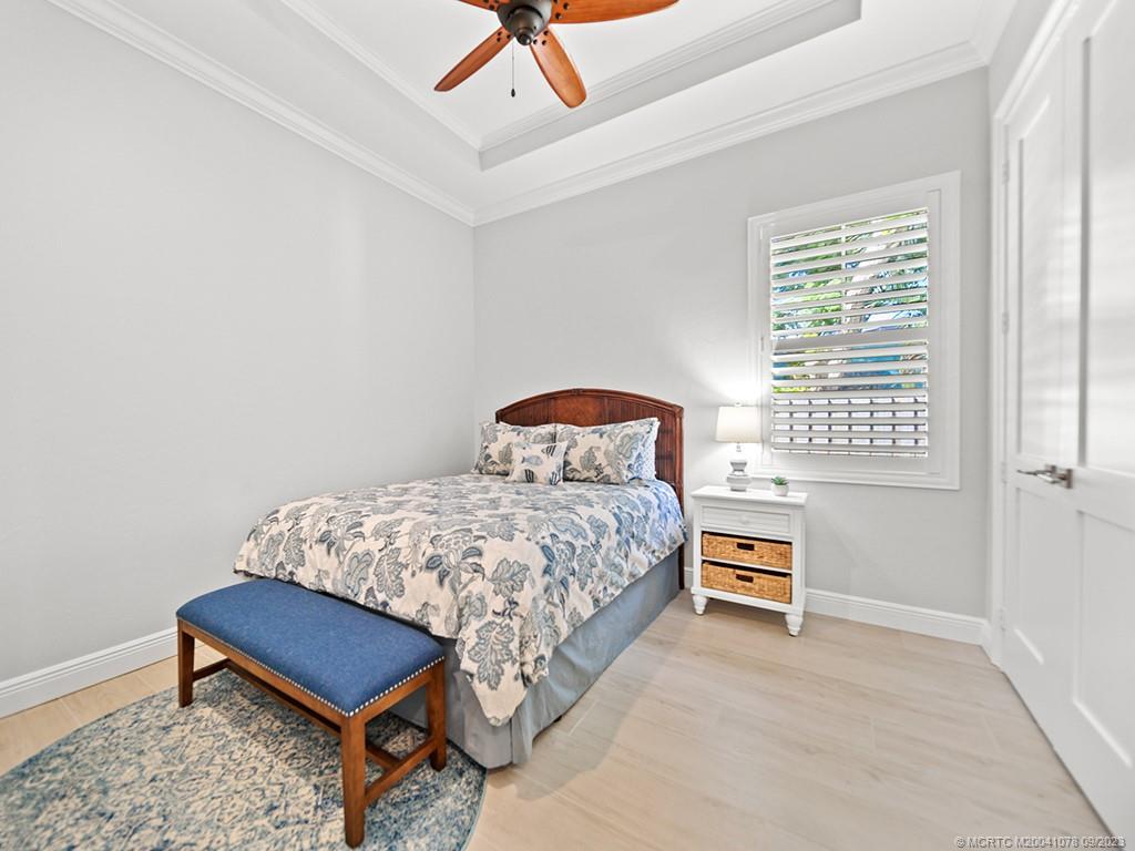 5714 Southeast Horseshoe Point Road Stuart, FL 34997 - Photo 37 of 83 a bedroom with a bed and a window