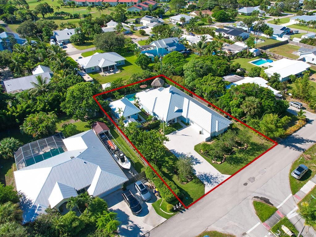5714 Southeast Horseshoe Point Road Stuart, FL 34997 - Photo 4 of 83 an aerial view of a house