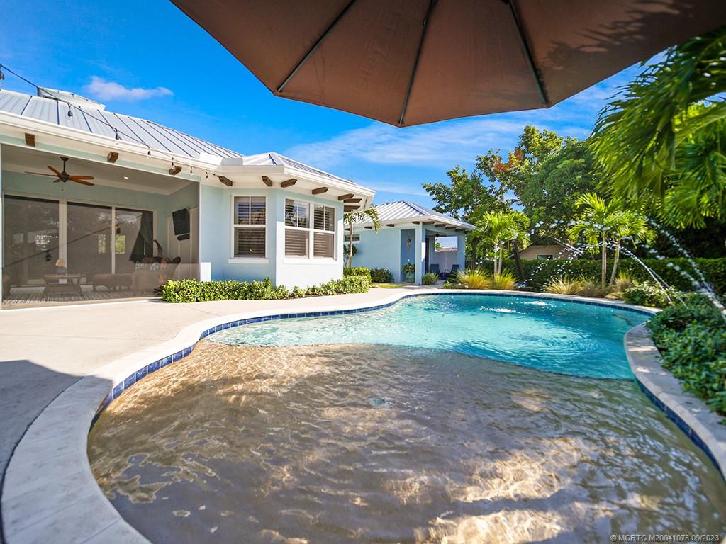 5714 Southeast Horseshoe Point Road Stuart, FL 34997 - Photo 52 of 83 a view of a house with a yard