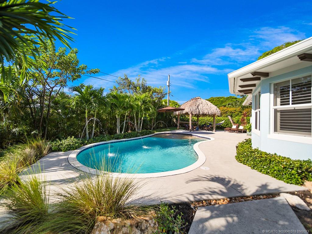 5714 Southeast Horseshoe Point Road Stuart, FL 34997 - Photo 53 of 83 a view of a swimming pool with a patio