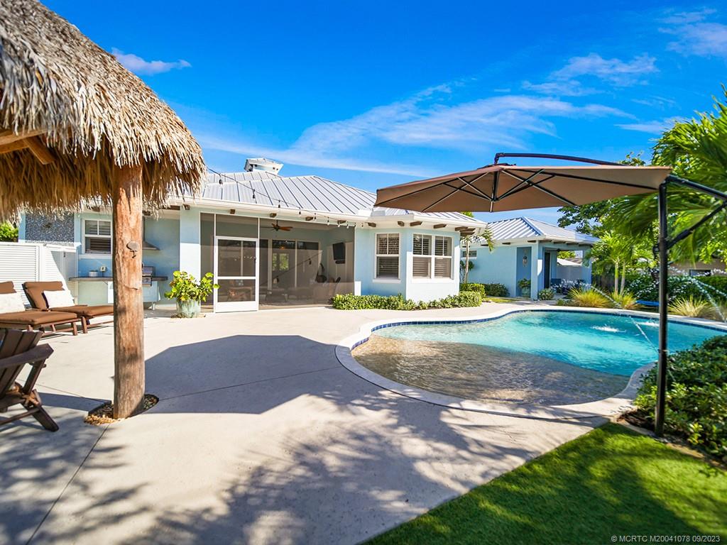 5714 Southeast Horseshoe Point Road Stuart, FL 34997 - Photo 56 of 83 a view of outdoor space yard deck patio and swimming pool
