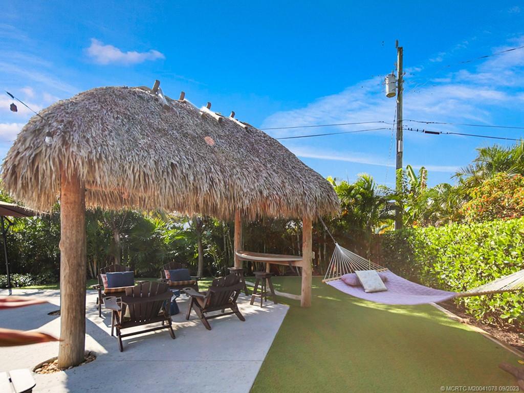 5714 Southeast Horseshoe Point Road Stuart, FL 34997 - Photo 58 of 83 a view of a chairs and tables in the patio