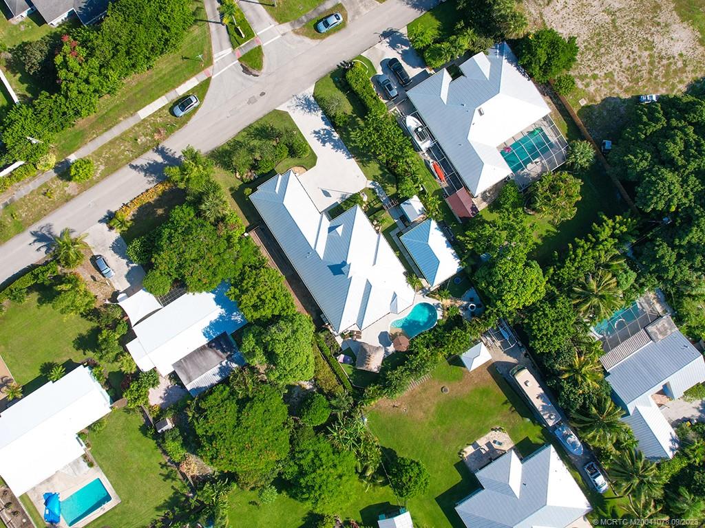 5714 Southeast Horseshoe Point Road Stuart, FL 34997 - Photo 6 of 83 an aerial view of a house with a yard