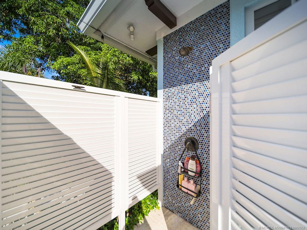 5714 Southeast Horseshoe Point Road Stuart, FL 34997 - Photo 61 of 83 a view of a balcony with chair and wooden floor