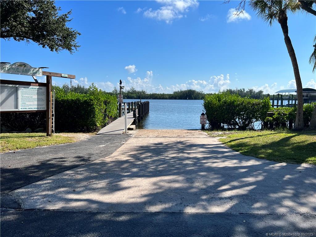 5714 Southeast Horseshoe Point Road Stuart, FL 34997 - Photo 74 of 83 a view of a swimming pool with a yard
