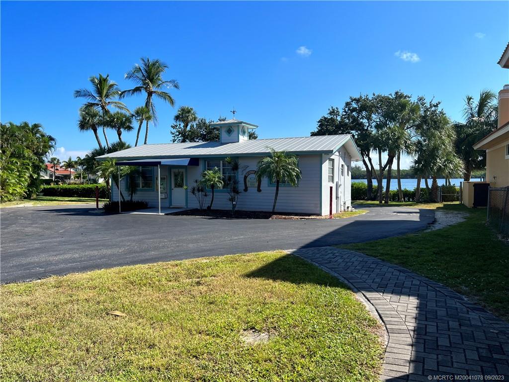 5714 Southeast Horseshoe Point Road Stuart, FL 34997 - Photo 75 of 83 a view of a house with a swimming pool