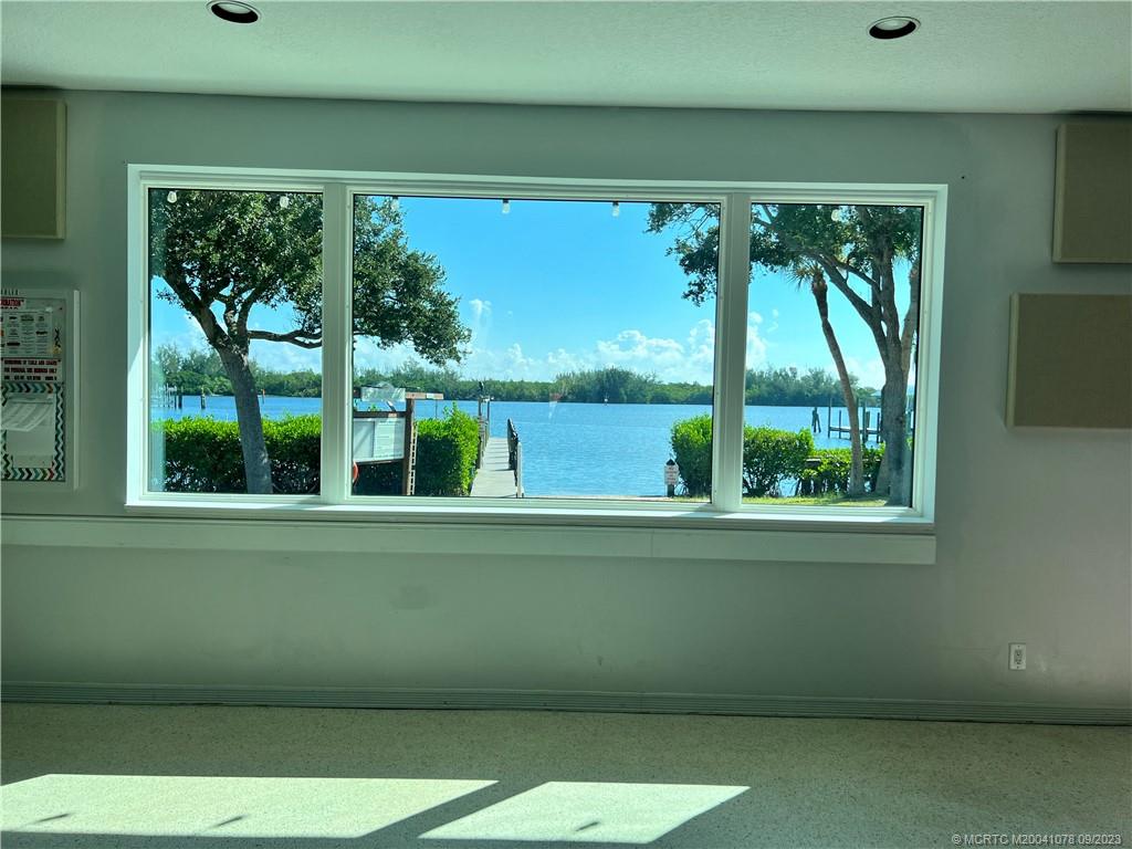 5714 Southeast Horseshoe Point Road Stuart, FL 34997 - Photo 76 of 83 a view of a room that has a large window