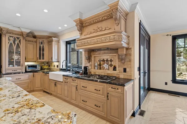 a kitchen with appliances cabinets and a table