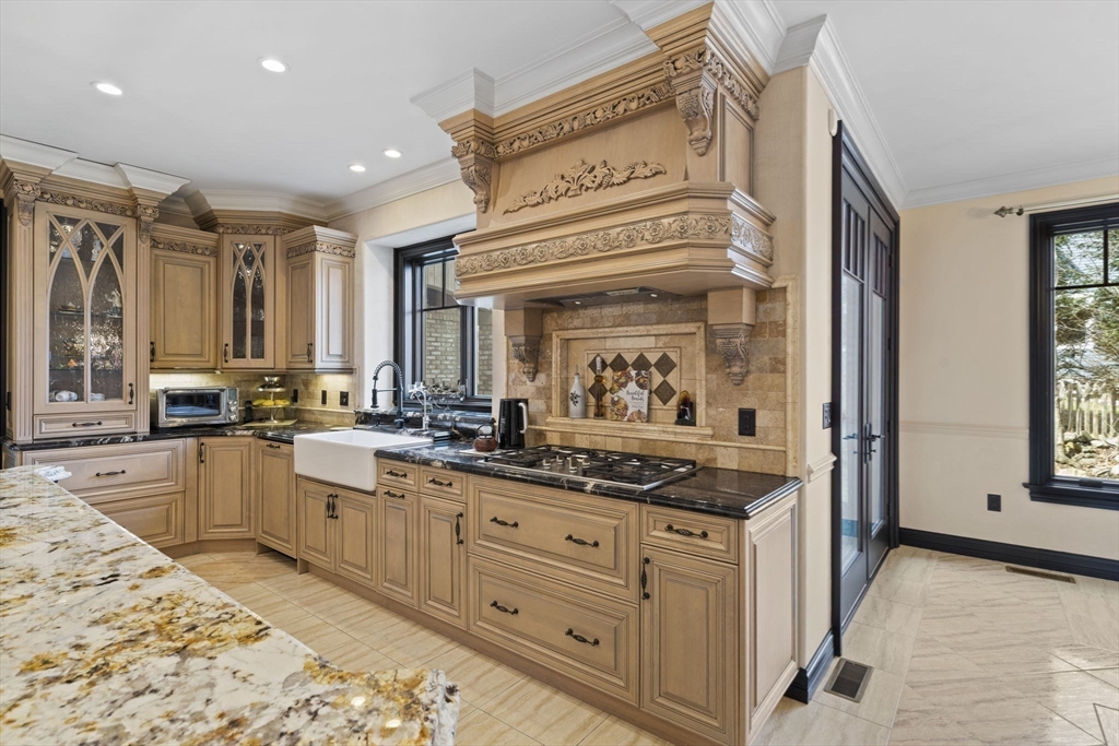 20 Boulder Road Newton, MA 02459 - Photo 11 of 42 a kitchen with appliances cabinets and a table