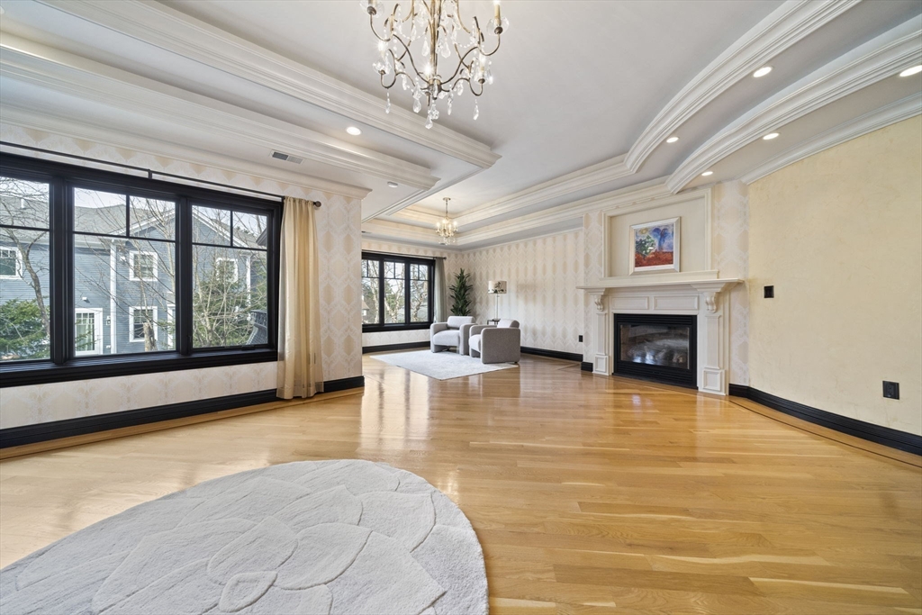 20 Boulder Road Newton, MA 02459 - Photo 18 of 42 a view of an empty room with furniture a fireplace and windows