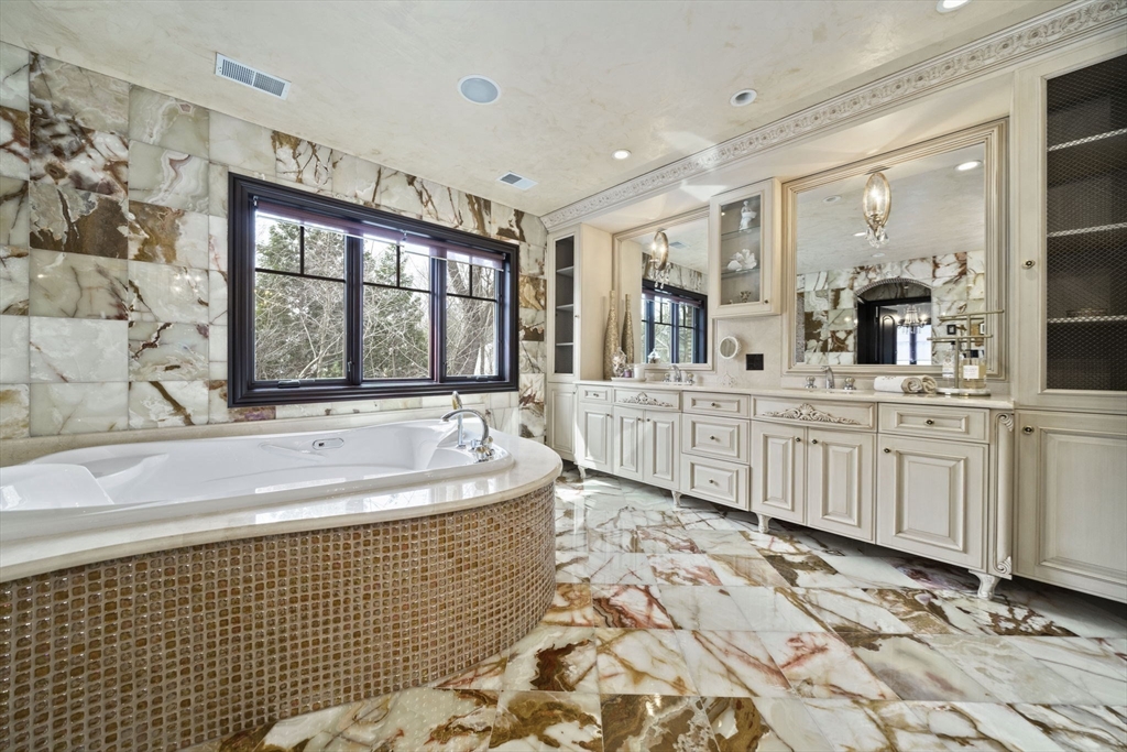 20 Boulder Road Newton, MA 02459 - Photo 20 of 42 a spacious bathroom with a tub sink and a mirror