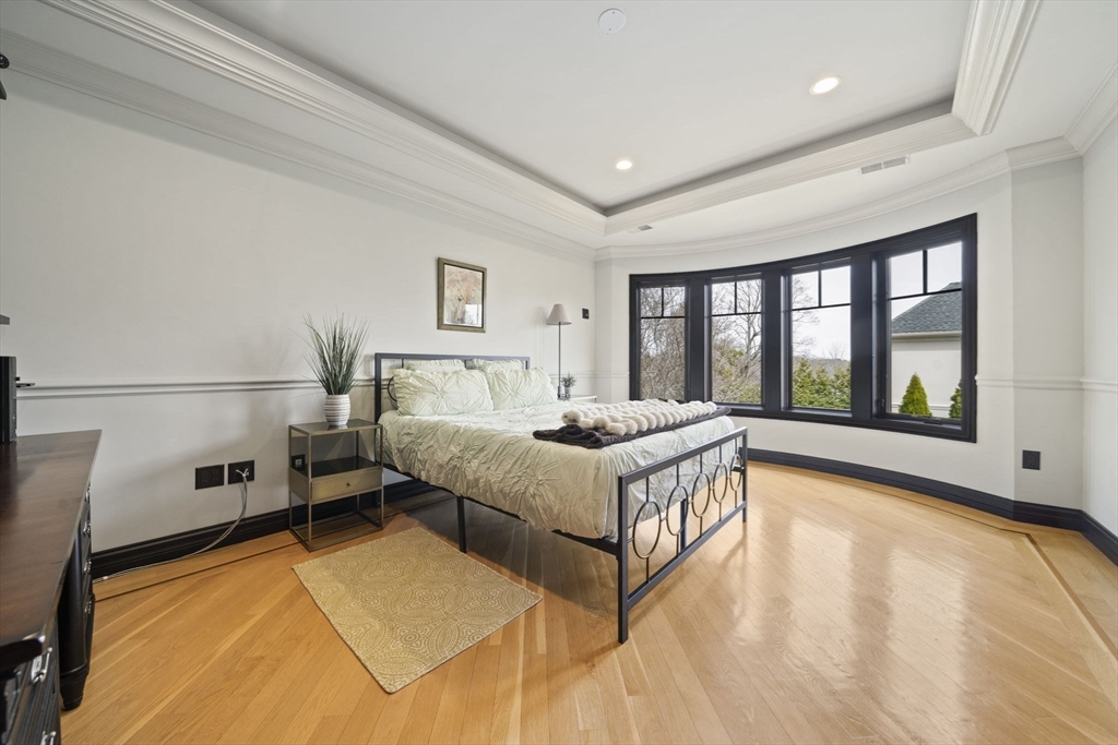 20 Boulder Road Newton, MA 02459 - Photo 26 of 42 a spacious bedroom with a bed and a large window