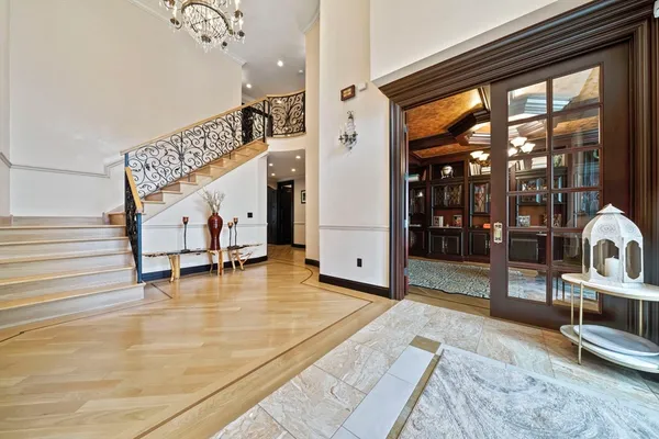 a view of an entryway with a dining table and chairs