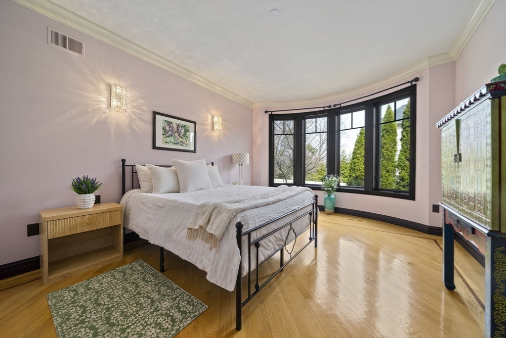 20 Boulder Road Newton, MA 02459 - Photo 34 of 42 a spacious bedroom with a bed and a dresser next to a window