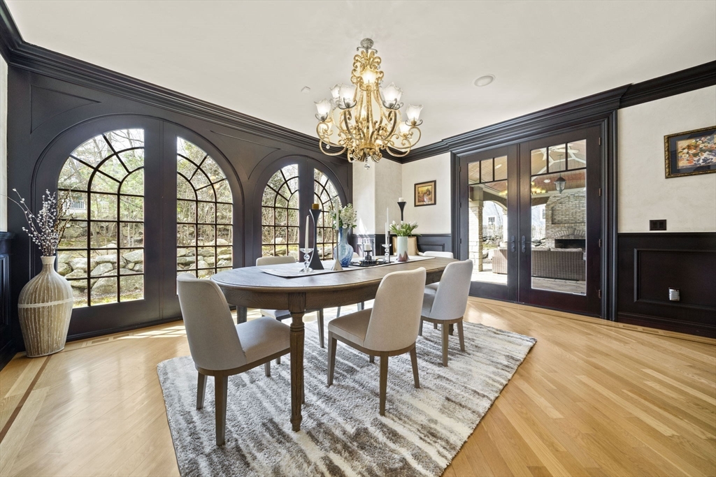 20 Boulder Road Newton, MA 02459 - Photo 7 of 42 a view of a dining room with furniture a chandelier and wooden floor