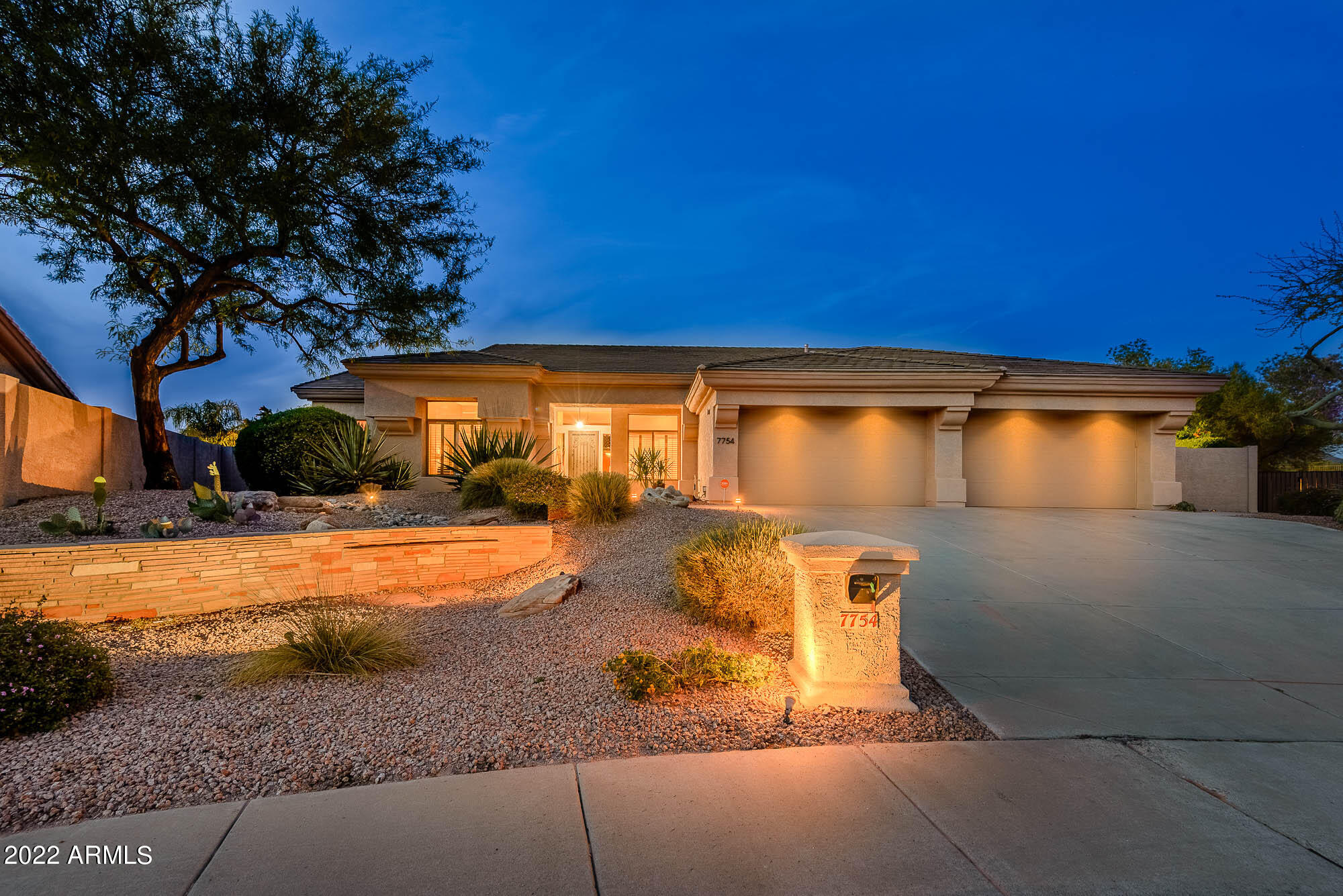 a view of a house with snow on the road