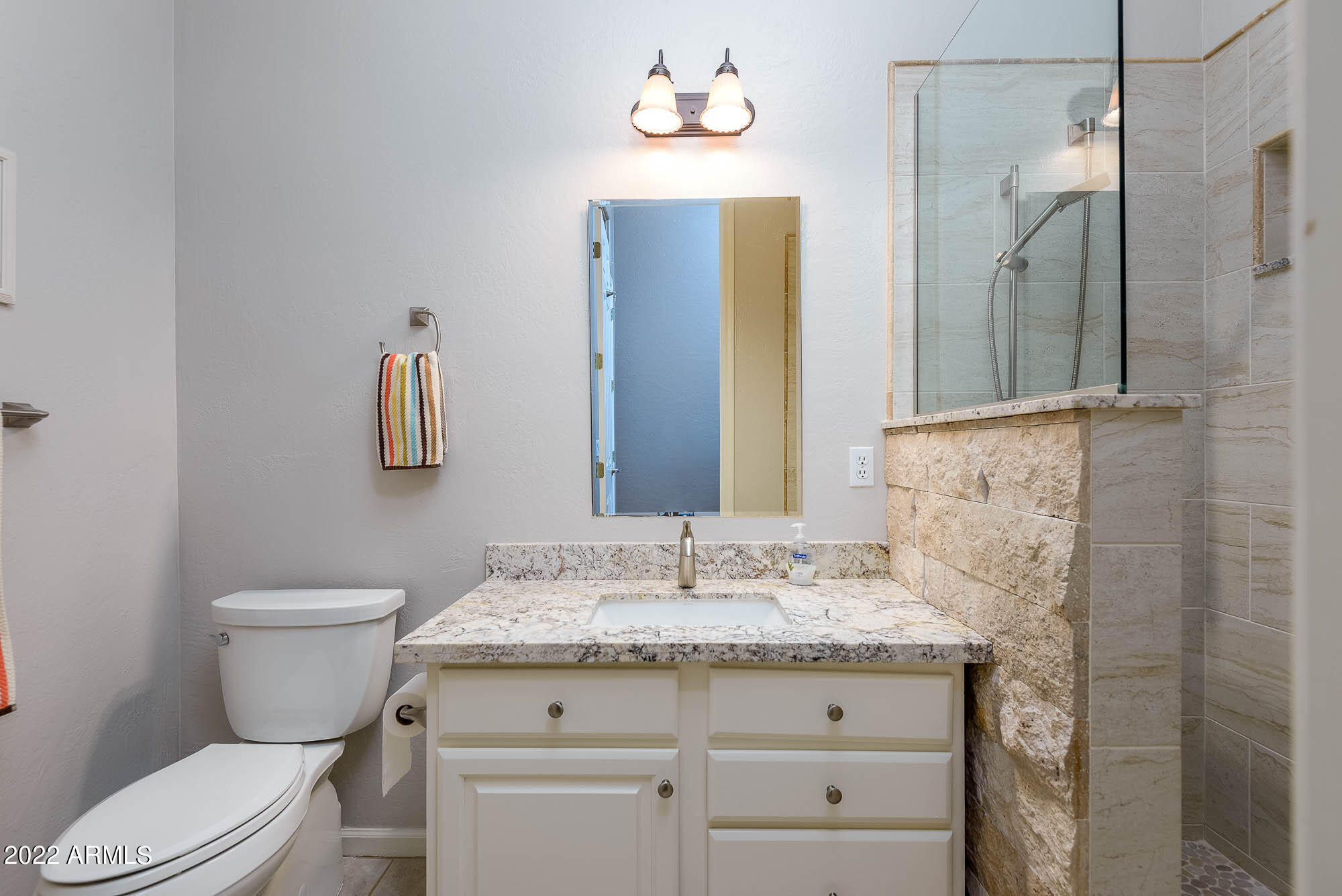 7754 East La Junta Road Scottsdale, AZ 85255 - Photo 14 of 72 a bathroom with a granite countertop sink vanity mirror and toilet