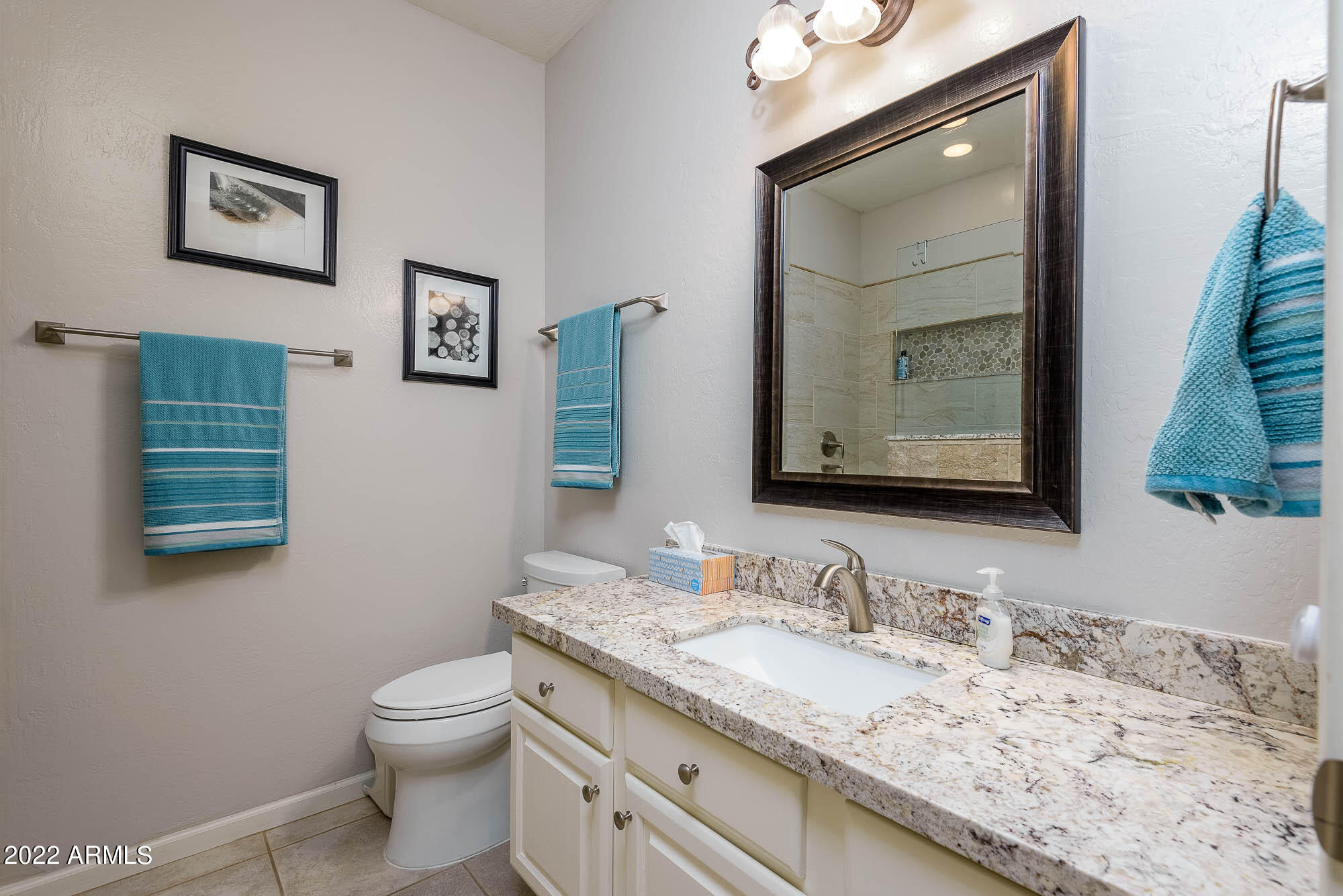 7754 East La Junta Road Scottsdale, AZ 85255 - Photo 17 of 72 a bathroom with a granite countertop sink vanity mirror and toilet