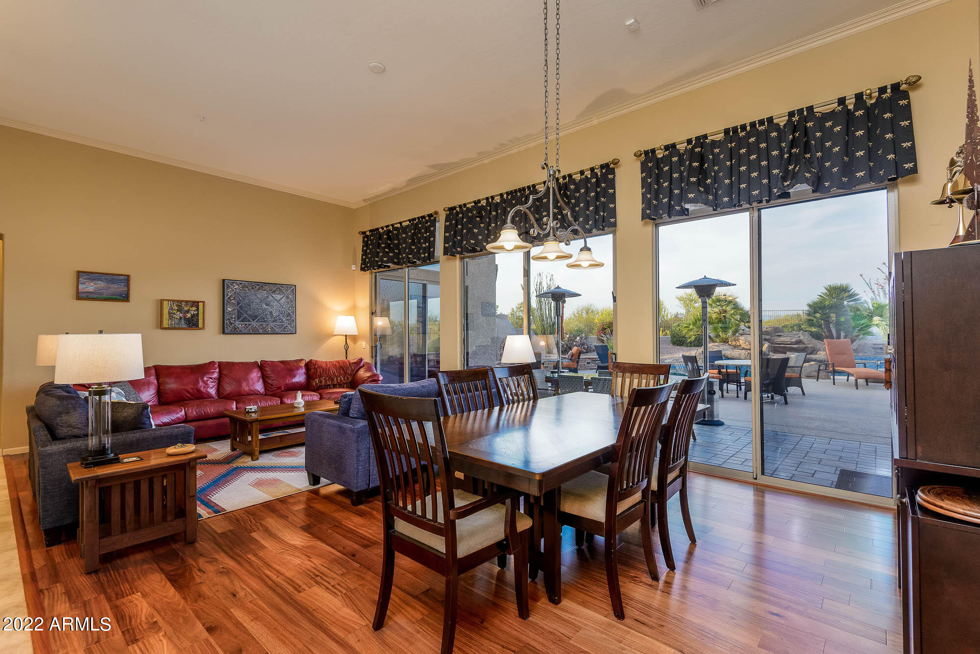 7754 East La Junta Road Scottsdale, AZ 85255 - Photo 22 of 72 a view of a dining room with furniture window and wooden floor
