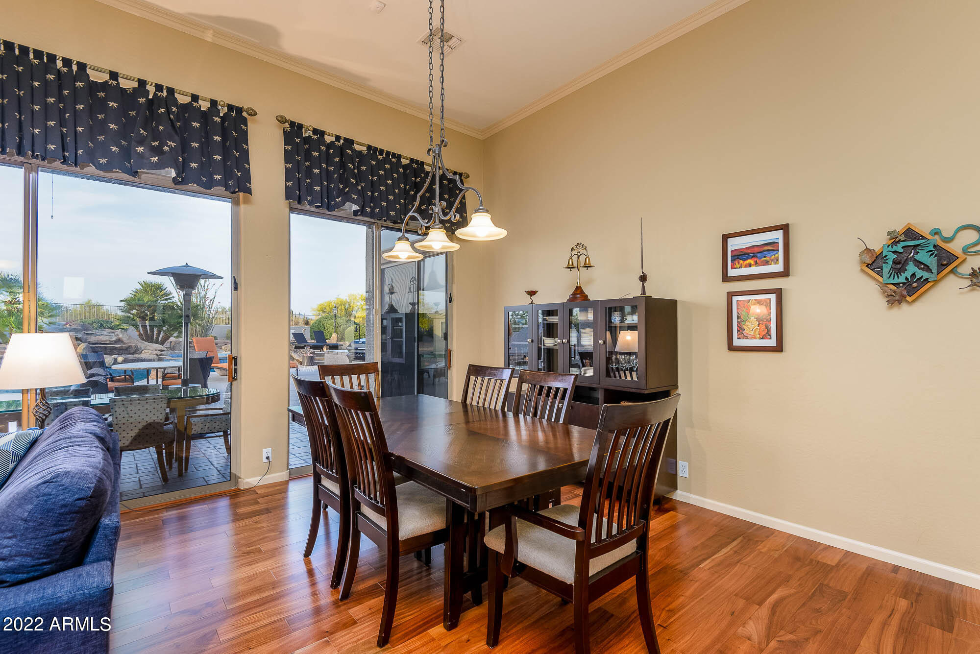 7754 East La Junta Road Scottsdale, AZ 85255 - Photo 23 of 72 a view of a dining room with furniture window and wooden floor