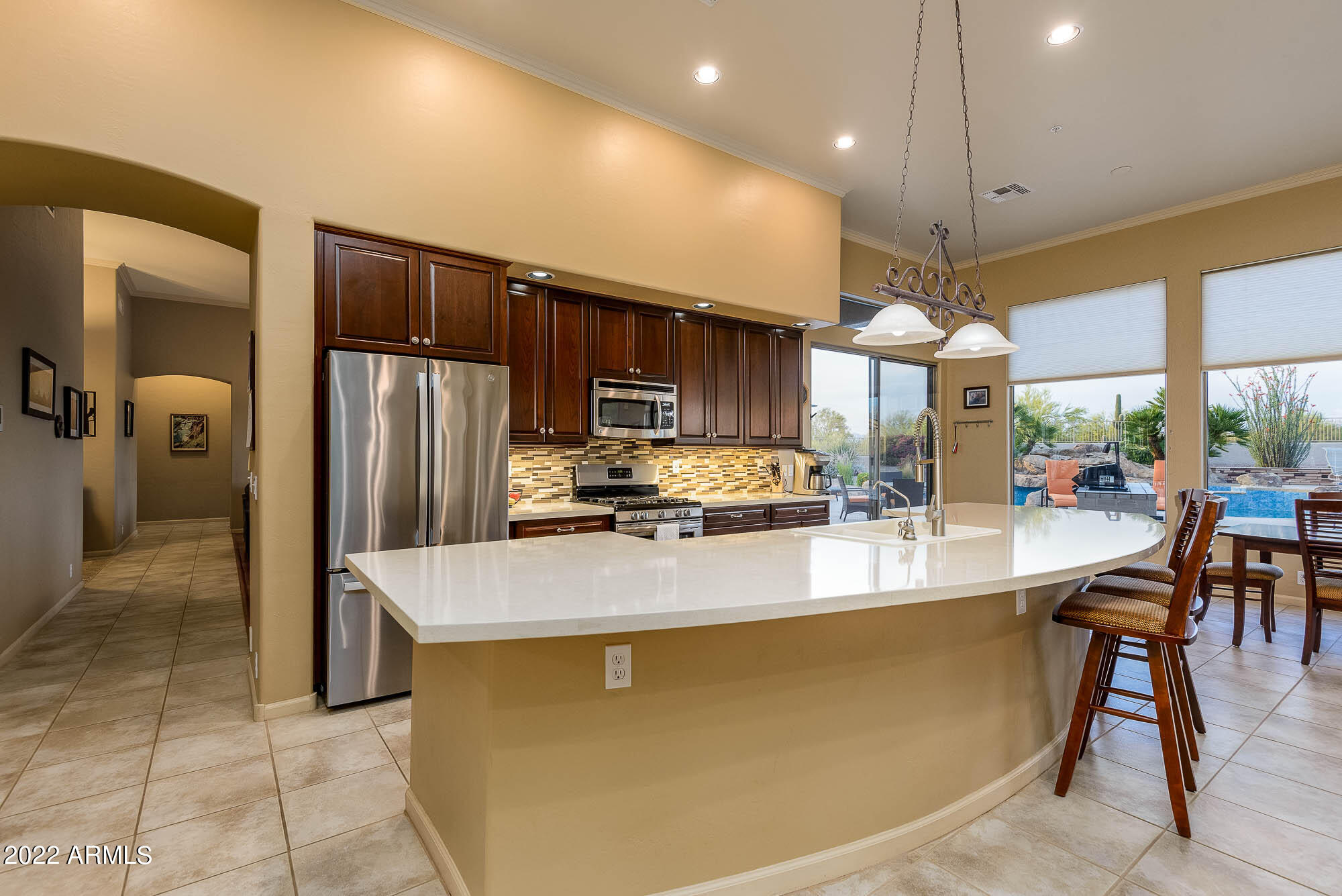 7754 East La Junta Road Scottsdale, AZ 85255 - Photo 29 of 72 a kitchen with stainless steel appliances granite countertop a sink a stove and a refrigerator