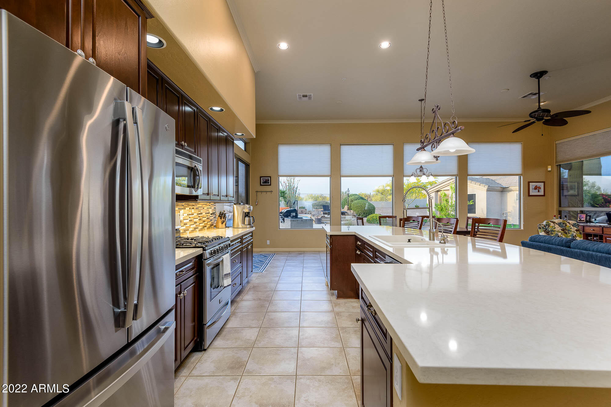 7754 East La Junta Road Scottsdale, AZ 85255 - Photo 30 of 72 a kitchen with stainless steel appliances granite countertop a refrigerator a sink and a stove
