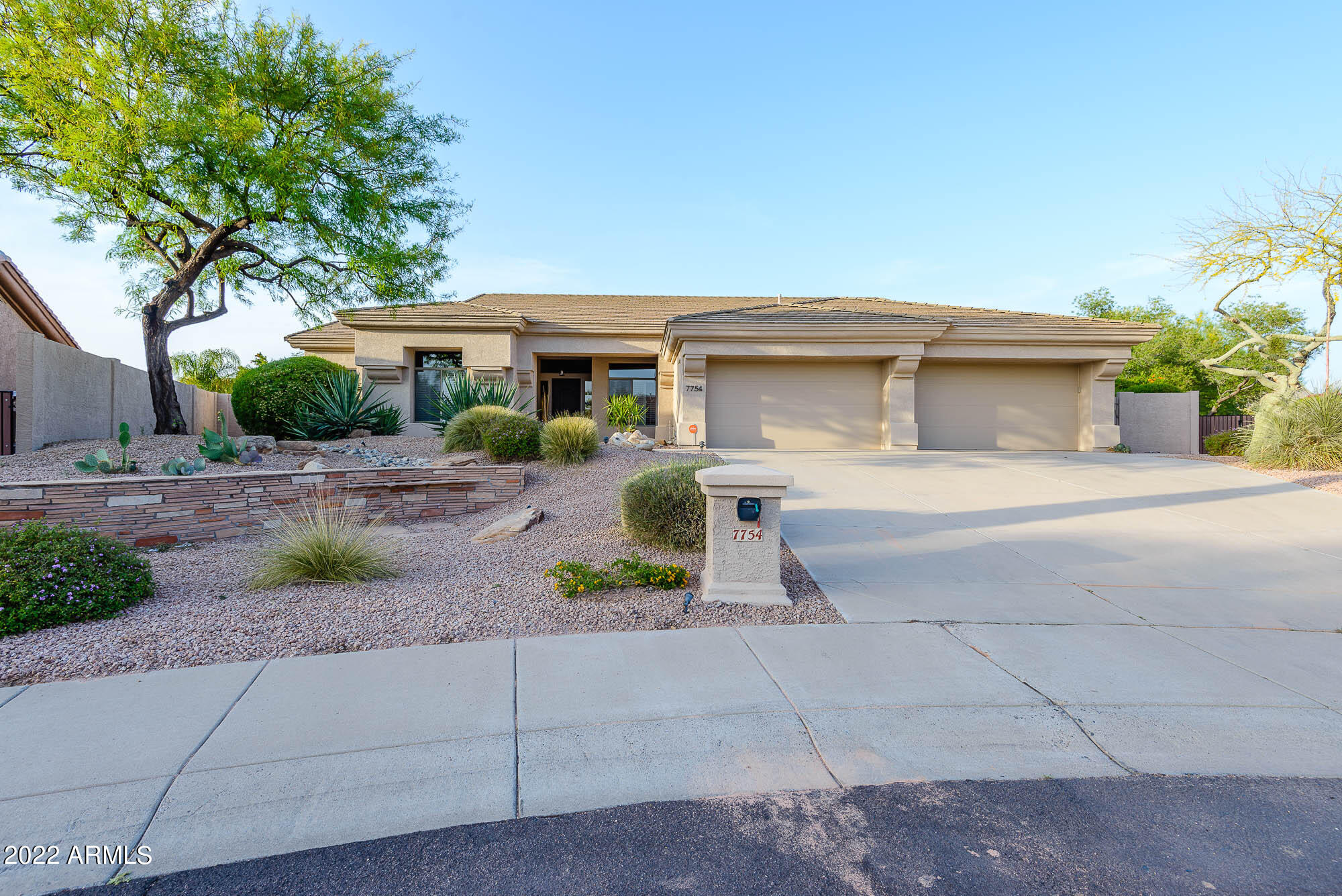 7754 East La Junta Road Scottsdale, AZ 85255 - Photo 4 of 72 a front view of a house with garden