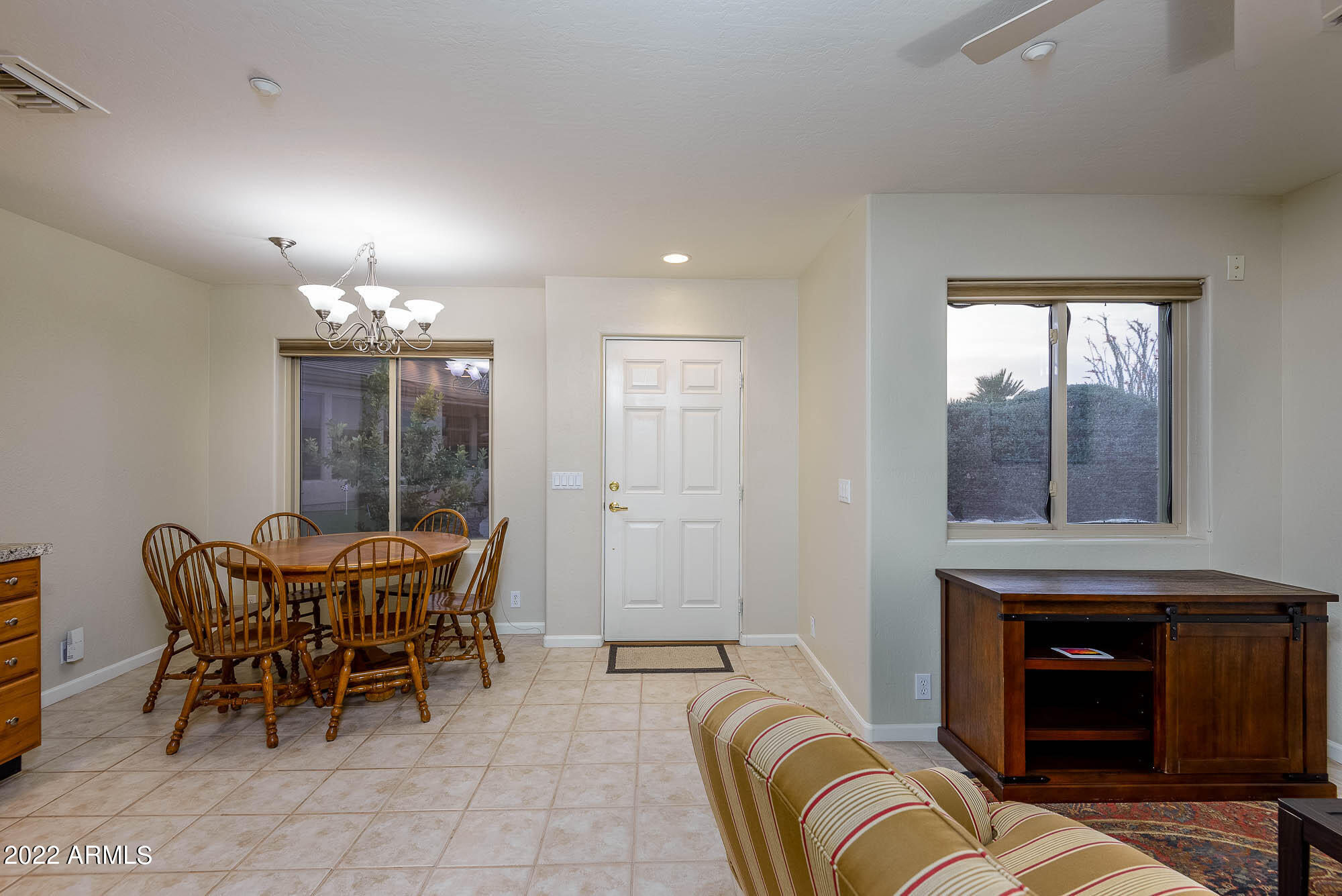 7754 East La Junta Road Scottsdale, AZ 85255 - Photo 44 of 72 a view of a livingroom with furniture and chandelier