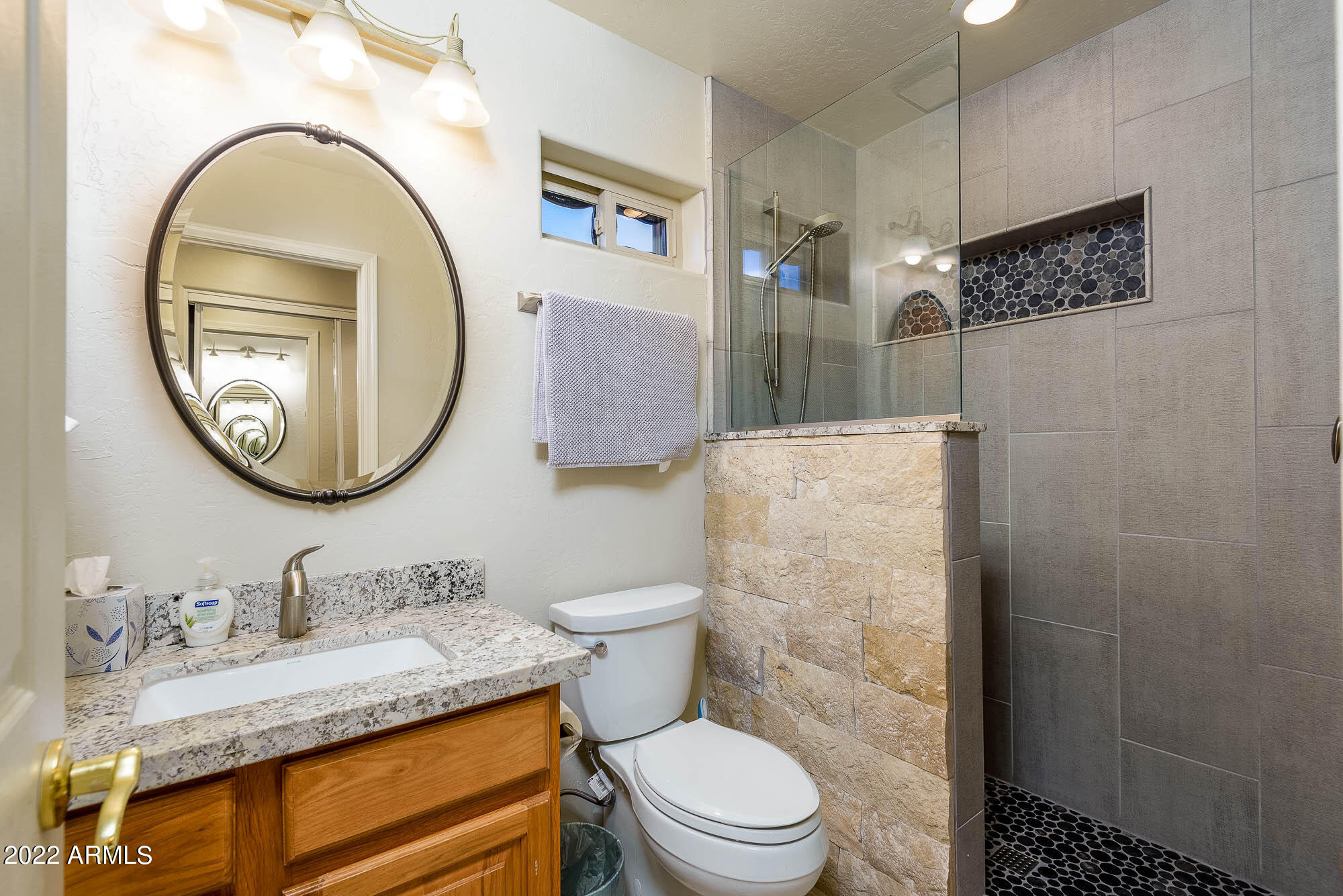 7754 East La Junta Road Scottsdale, AZ 85255 - Photo 47 of 72 a bathroom with a granite countertop toilet sink and mirror