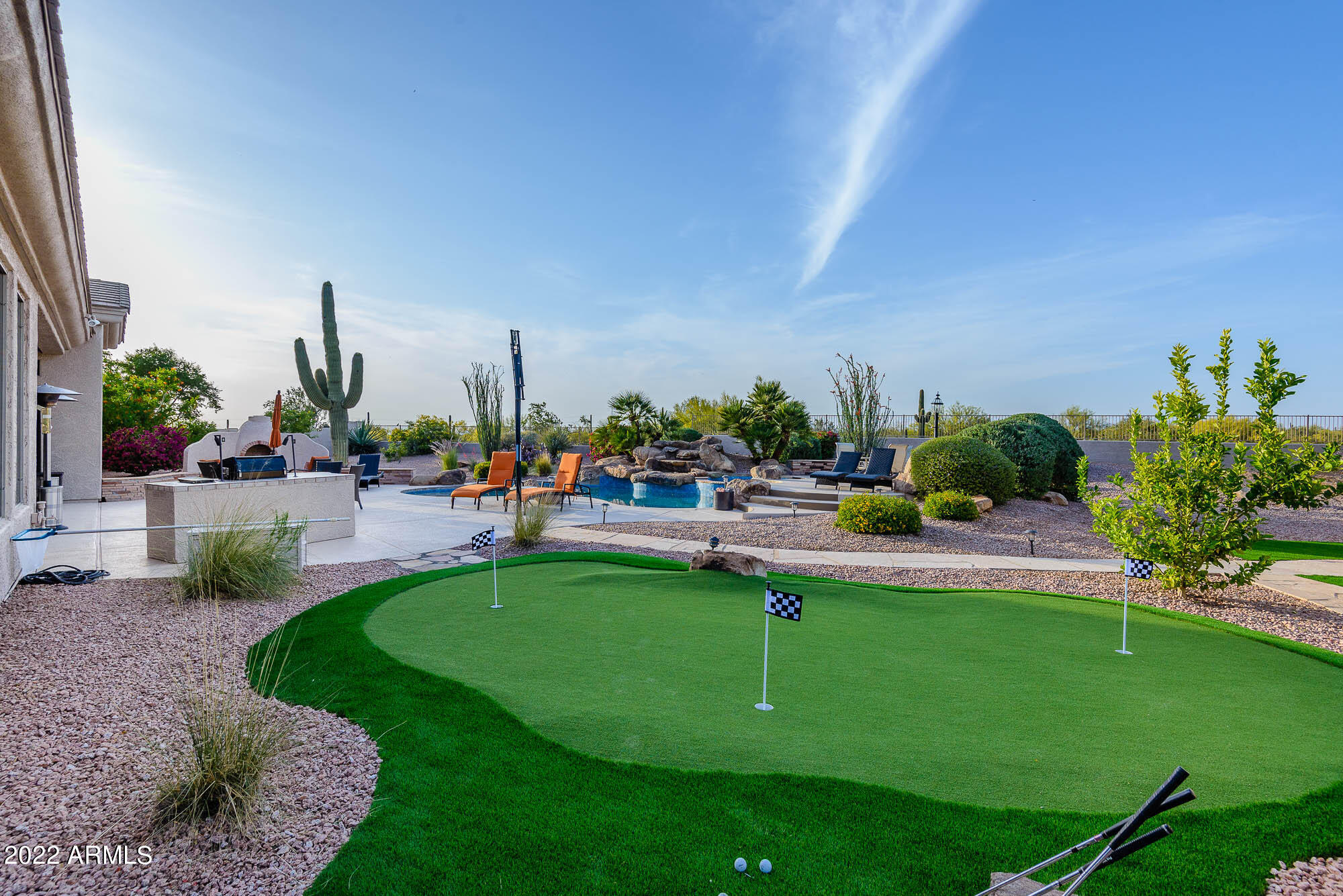 7754 East La Junta Road Scottsdale, AZ 85255 - Photo 52 of 72 a view of a swimming pool and outdoor seating