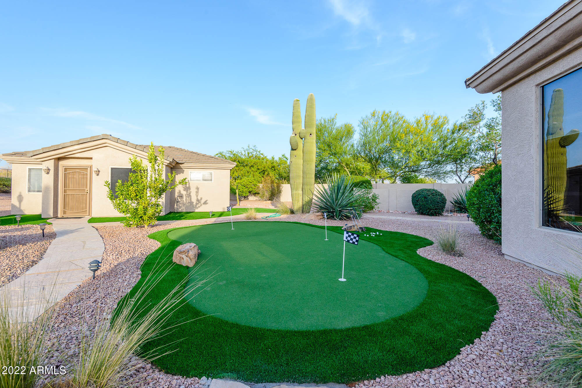 7754 East La Junta Road Scottsdale, AZ 85255 - Photo 53 of 72 a view of a house with a backyard porch and sitting area
