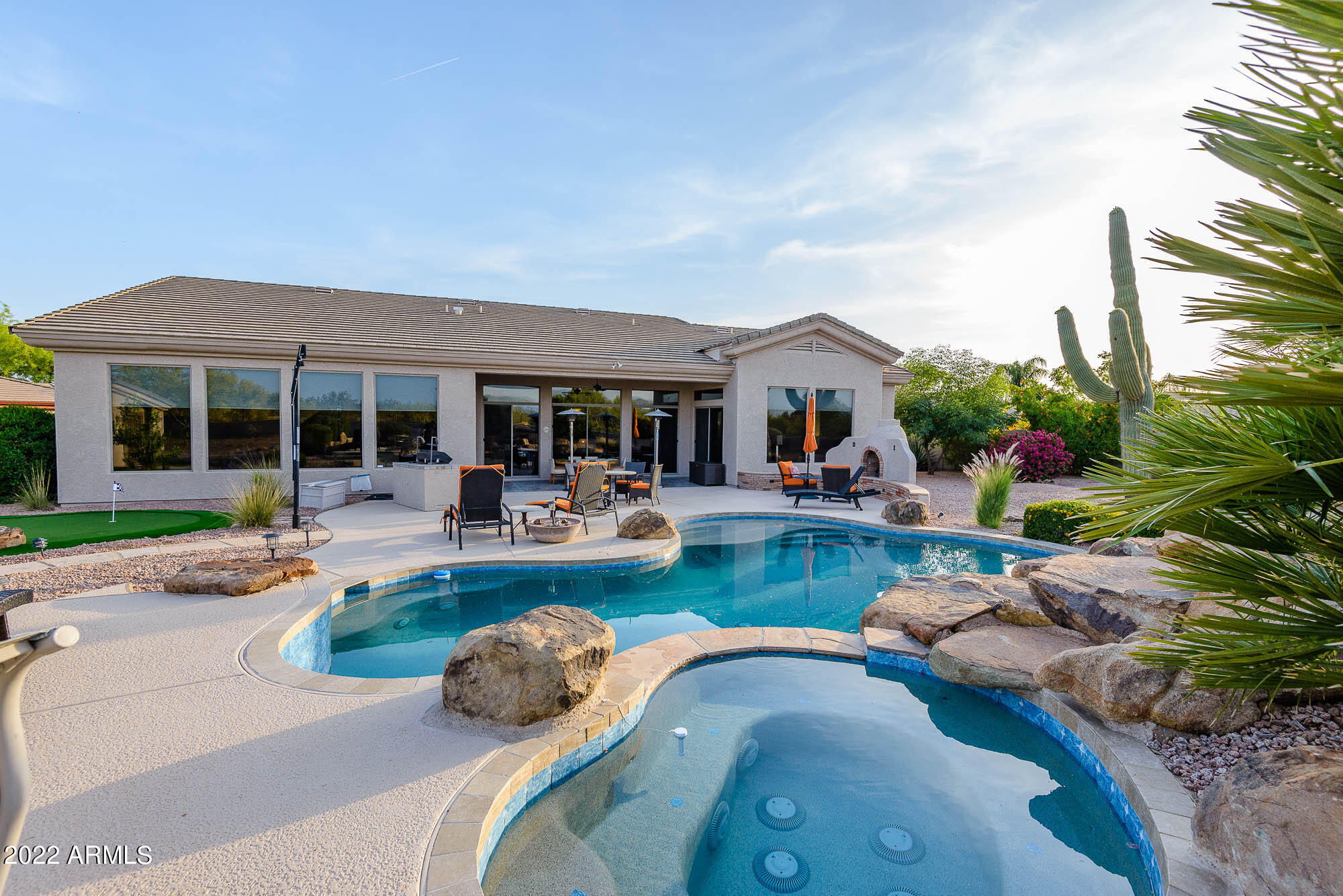 7754 East La Junta Road Scottsdale, AZ 85255 - Photo 54 of 72 a view of a house with swimming pool and porch with furniture