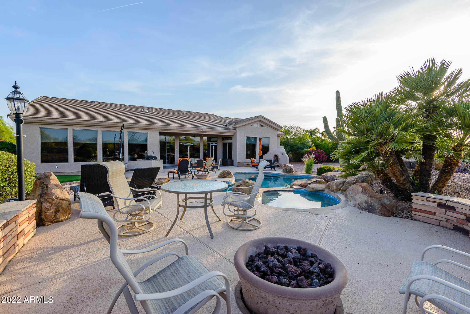 7754 East La Junta Road Scottsdale, AZ 85255 - Photo 60 of 72 a view of a patio with dining table and chairs with plants
