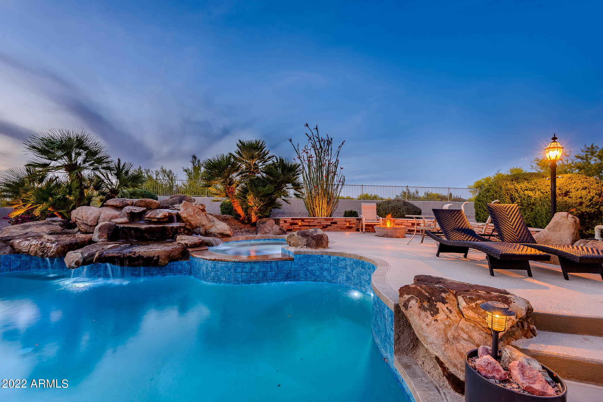 7754 East La Junta Road Scottsdale, AZ 85255 - Photo 67 of 72 a view of a backyard with swimming pool and lawn chairs