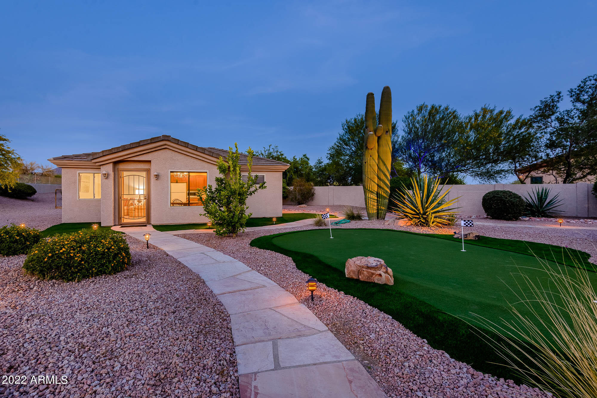 7754 East La Junta Road Scottsdale, AZ 85255 - Photo 68 of 72 a front view of a house with garden