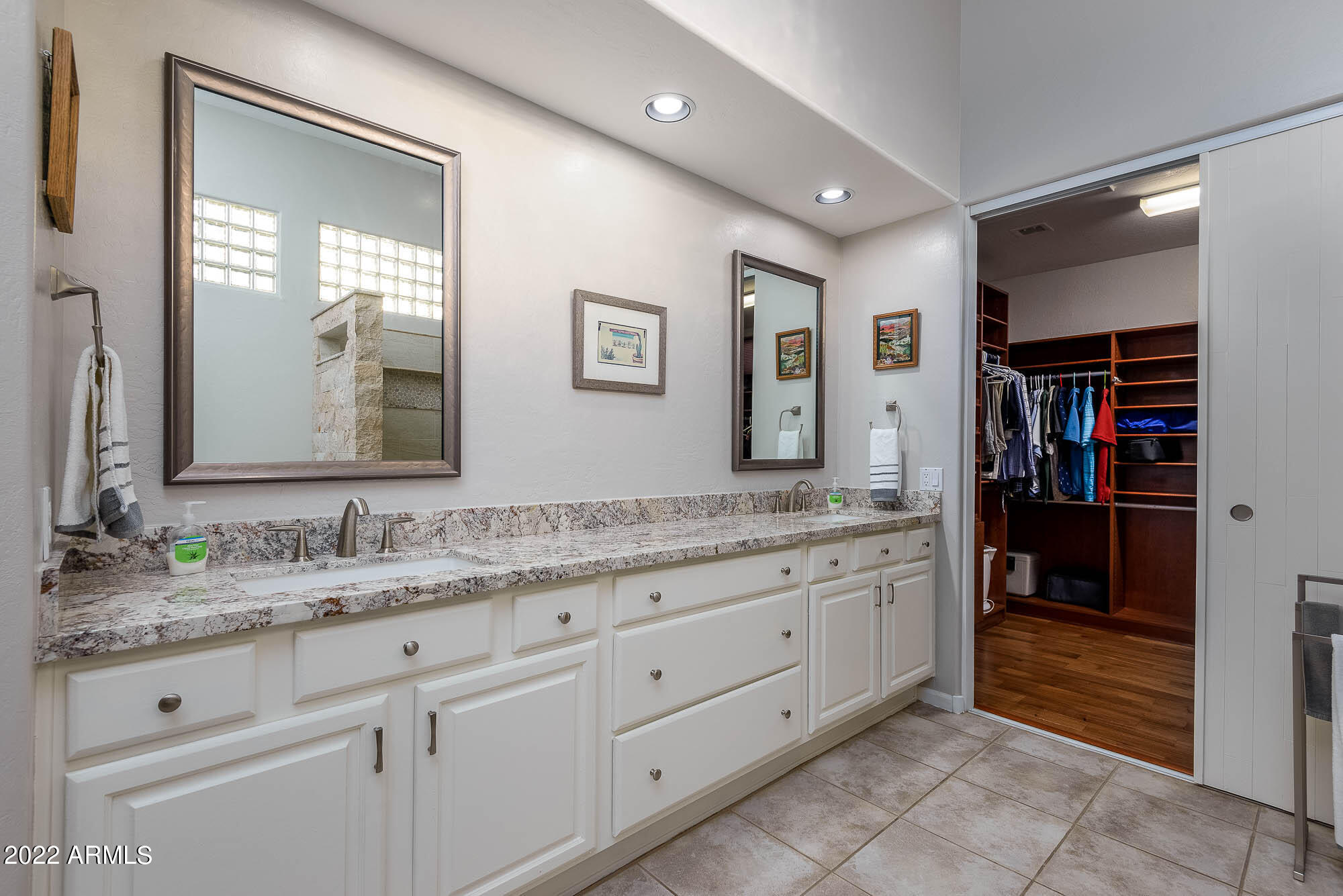7754 East La Junta Road Scottsdale, AZ 85255 - Photo 8 of 72 a bathroom with a granite countertop double vanity sink and a mirror