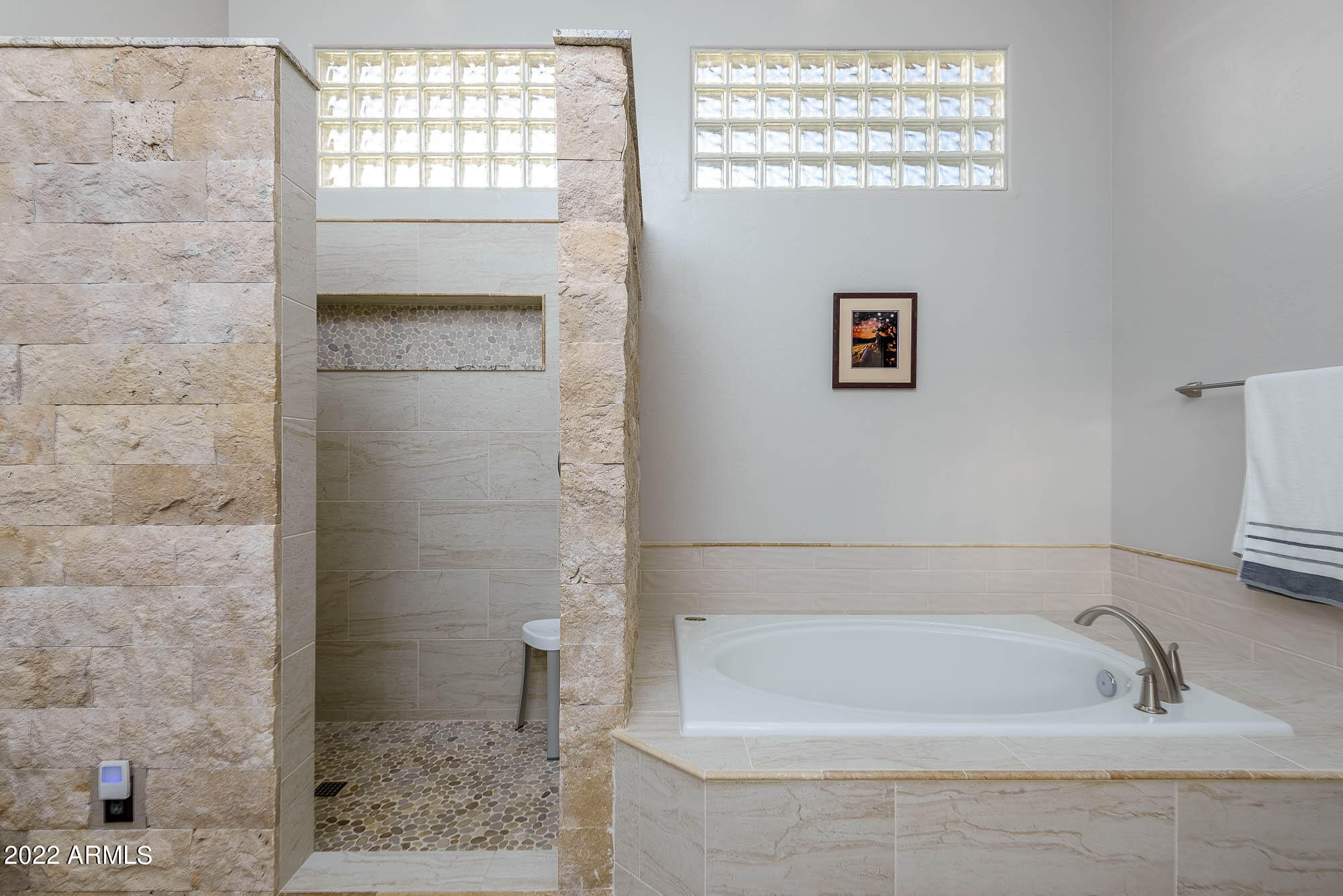 7754 East La Junta Road Scottsdale, AZ 85255 - Photo 10 of 72 a bathroom with a bathtub and a shower