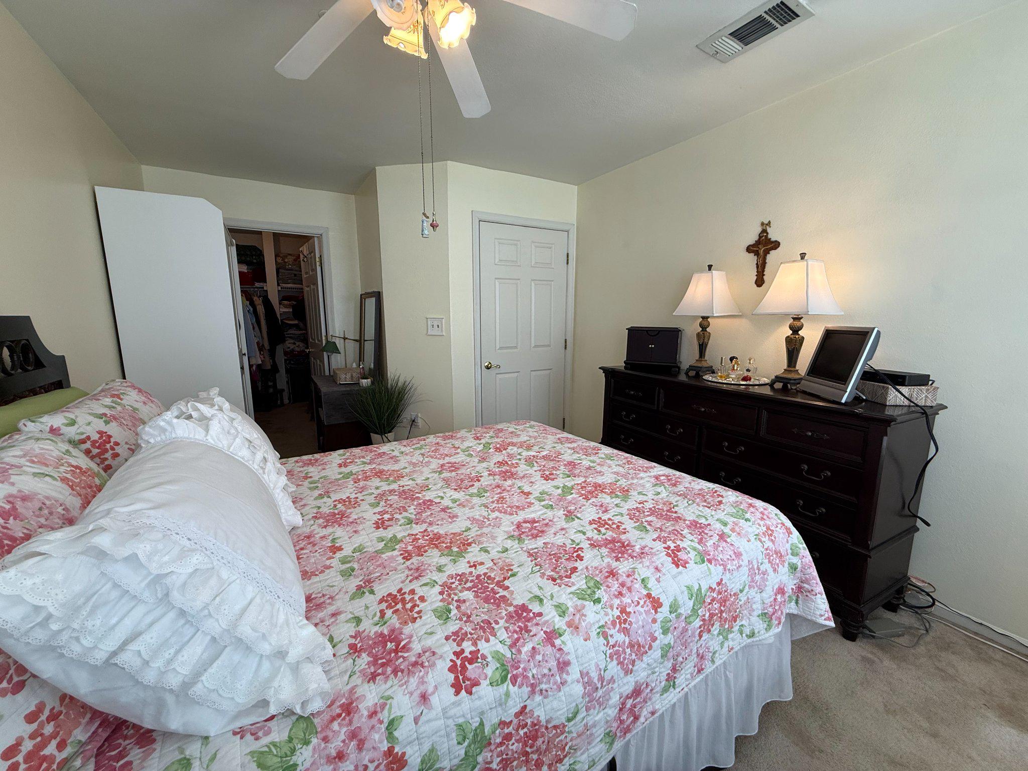 302 Canterbury Road, Unit 302E Bel Air, MD 21014 - Photo 18 of 39 a bedroom with a bed and a chandelier